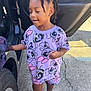 Chanel joined the competition — help win amazing prizes! bow, car_door, casual, child, concrete, earrings, girl, hair, outdoor, patterned_shirt, person, playful, purple_clothing, reflection, shorts, sidewalk, smiling, sneakers, sunlight, wheel