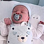 baby, newborn, pacifier, sleeping, hat, clothing, onesie, bear_design, striped, hand, face, infant, cute, soft, blanket, resting, indoors, peaceful, headwear, child