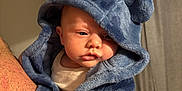 Jacob is registered to the contest to win money with this photo: baby, blue_hoodie, child, cute, face, fluffy, hood, indoor, infant, light, looking, person, portrait, sleepy, soft, wearing, warm, young, hand, skin