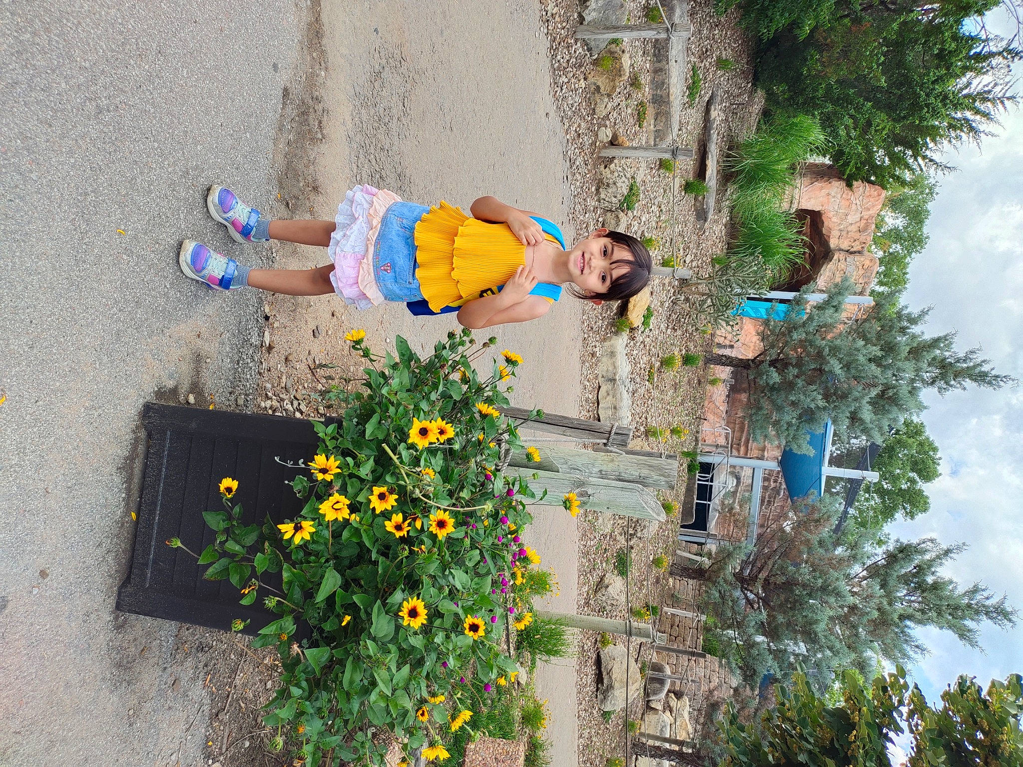 Jessica joined the competition — help win amazing prizes! annual_plant, blue, facade, flower, flowering_plant, fun, glasses, grass, green, landscape, leisure, plant, recreation, shrub, sky, summer, sunglasses, tree, wall, yellow