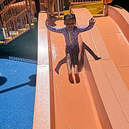 Romi joined the competition — help win amazing prizes! active, child, childhood, daytime, fun, girl, happy, leisure, outdoor, play, playground, recreation, slide, smile, sport, summer, sunlight, swimsuit, water, waterslide