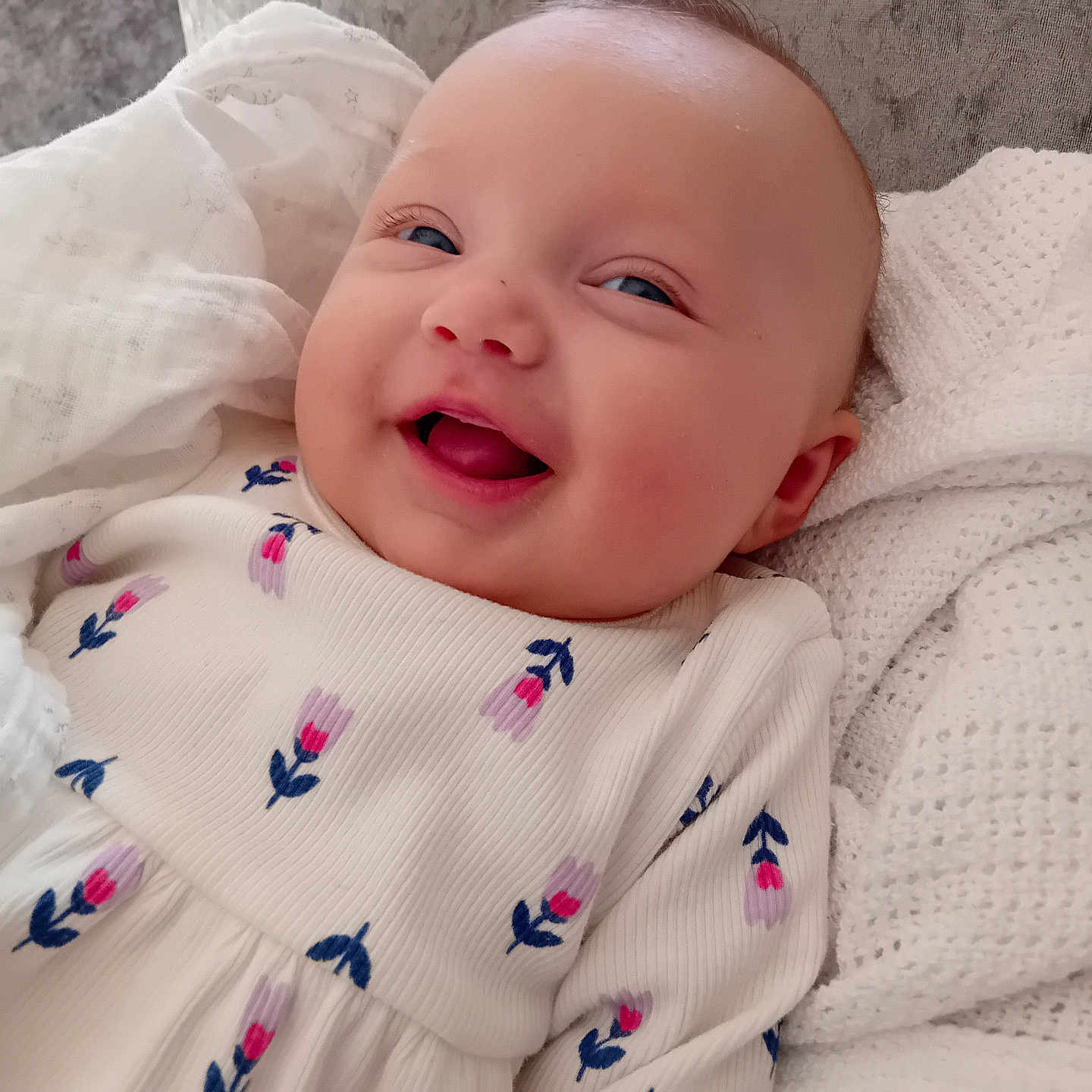 Mia joined the competition — help win amazing prizes! applique, baby, babylaughing, blanket, bodypart, brush, device, face, finger, hand, happy, head, laughing, mouth, newborn, pattern, person, photography, portrait, smile