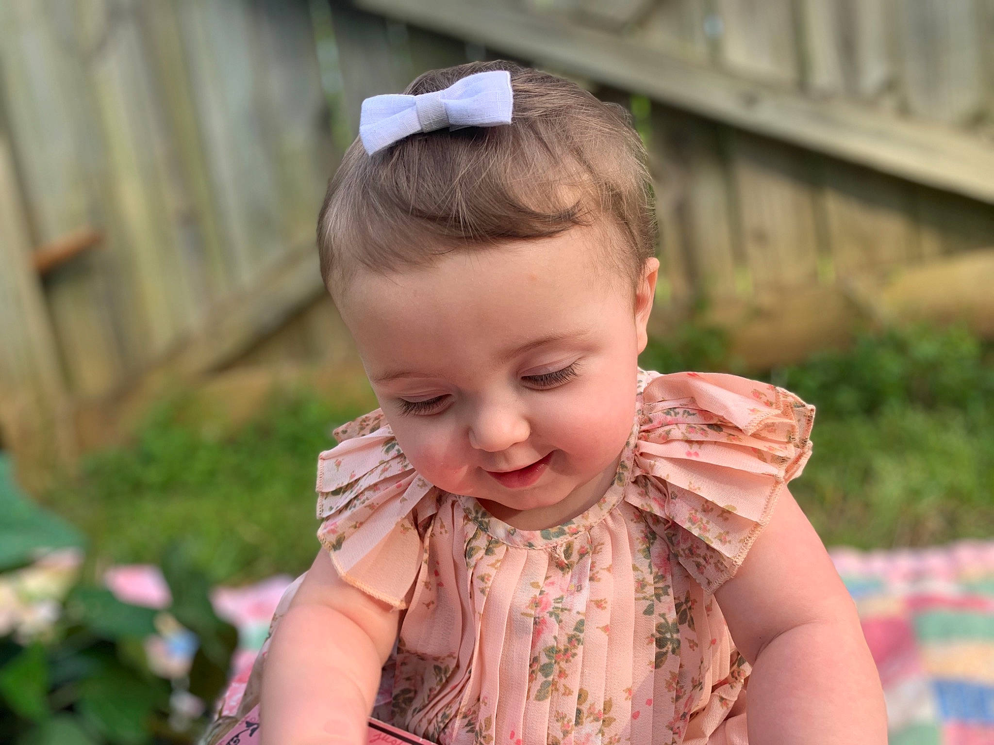 Danielle joined the competition — help win amazing prizes! baby, baby_toddler_clothing, blond, child, chin, dress, eye, fashion_accessory, fun, grass, happy, iris, jewellery, leisure, pattern, person, plant, sitting, skin, t_shirt