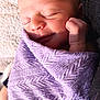 newborn, baby, sleeping, wrapped, blanket, lavender, soft, peaceful, smile, face, hand, cozy, texture, closeup, infant, skin, cute, resting, portrait, natural_light