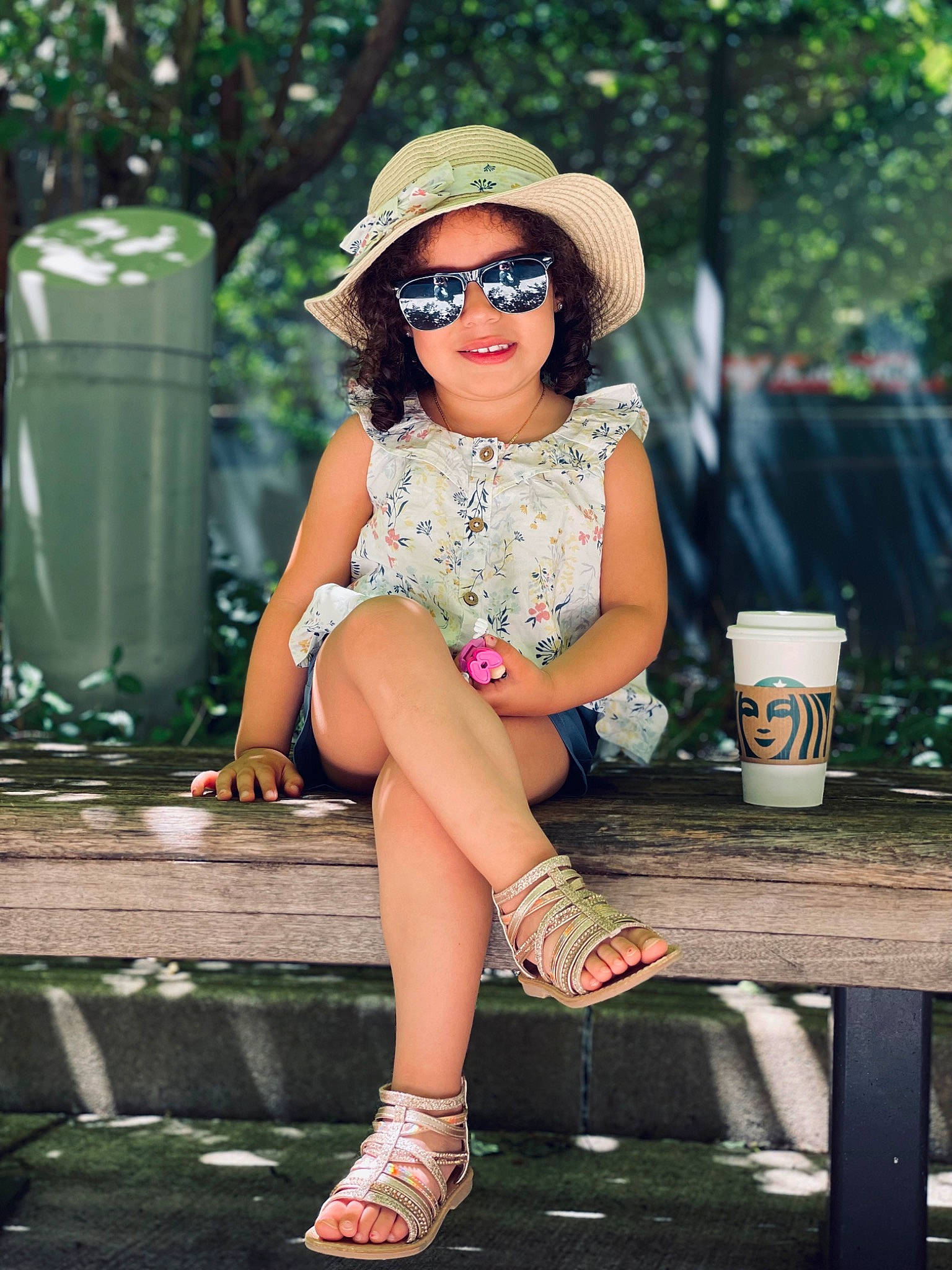 Khyla is registered to the contest to win money with this photo: cap, cool, eyewear, goggles, grass, green, hat, human_leg, joy, knee, leisure, person, pink, sandal, smile, style, summer, sun_hat, sunglasses, thigh