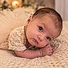 baby, infant, child, portrait, lying_down, tummy_time, blanket, bed, knitted_blanket, lace_clothing, brown_hair, blue_eyes, face, eyes, indoor, cozy, home, soft_lighting, cute, photography