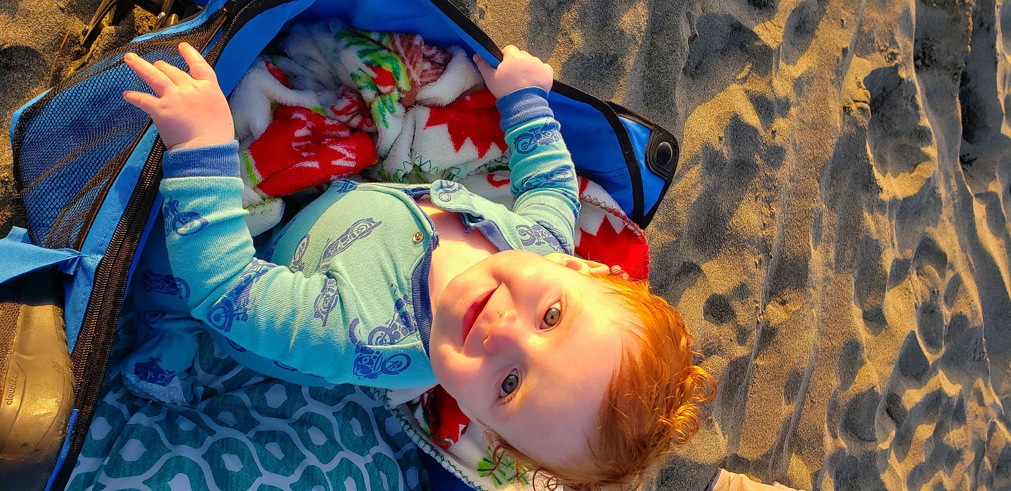 Fallon is registered to the contest to win money with this photo: baby, beach, child, electric_blue, fun, grass, happy, hat, joy, landscape, leisure, mouth, orange, pattern, people_in_nature, person, personal_protective_equipment, play, smile, toddler