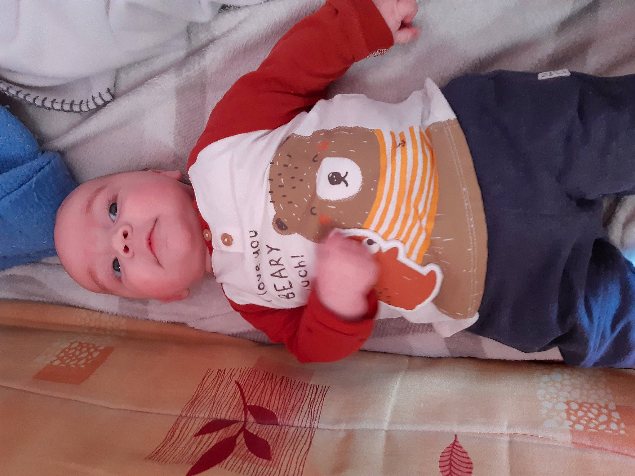 Quentin participe au concours pour gagner de l'argent avec cette photo : arm, baby, baby_products, baby_sleeping, baby_toddler_clothing, cheek, child, comfort, eye, hand, hat, headwear, human_body, pattern, person, product, room, skin, sleeve, textile