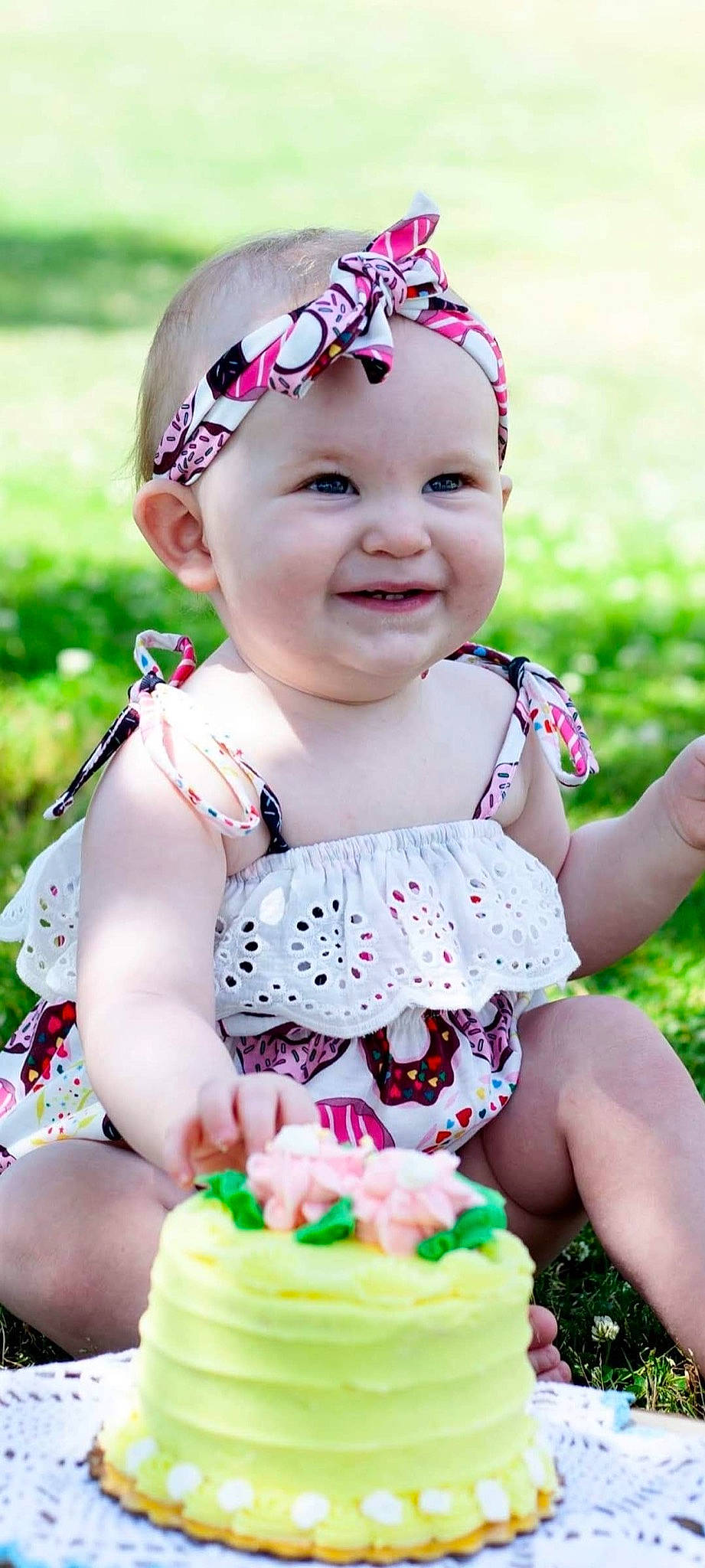 Charlotte joined the competition — help win amazing prizes! baby, baby_toddler_clothing, blue, dress, eye, facial_expression, grass, green, happy, headwear, joy, lip, pattern, people, person, photograph, pink, purple, skin, smile