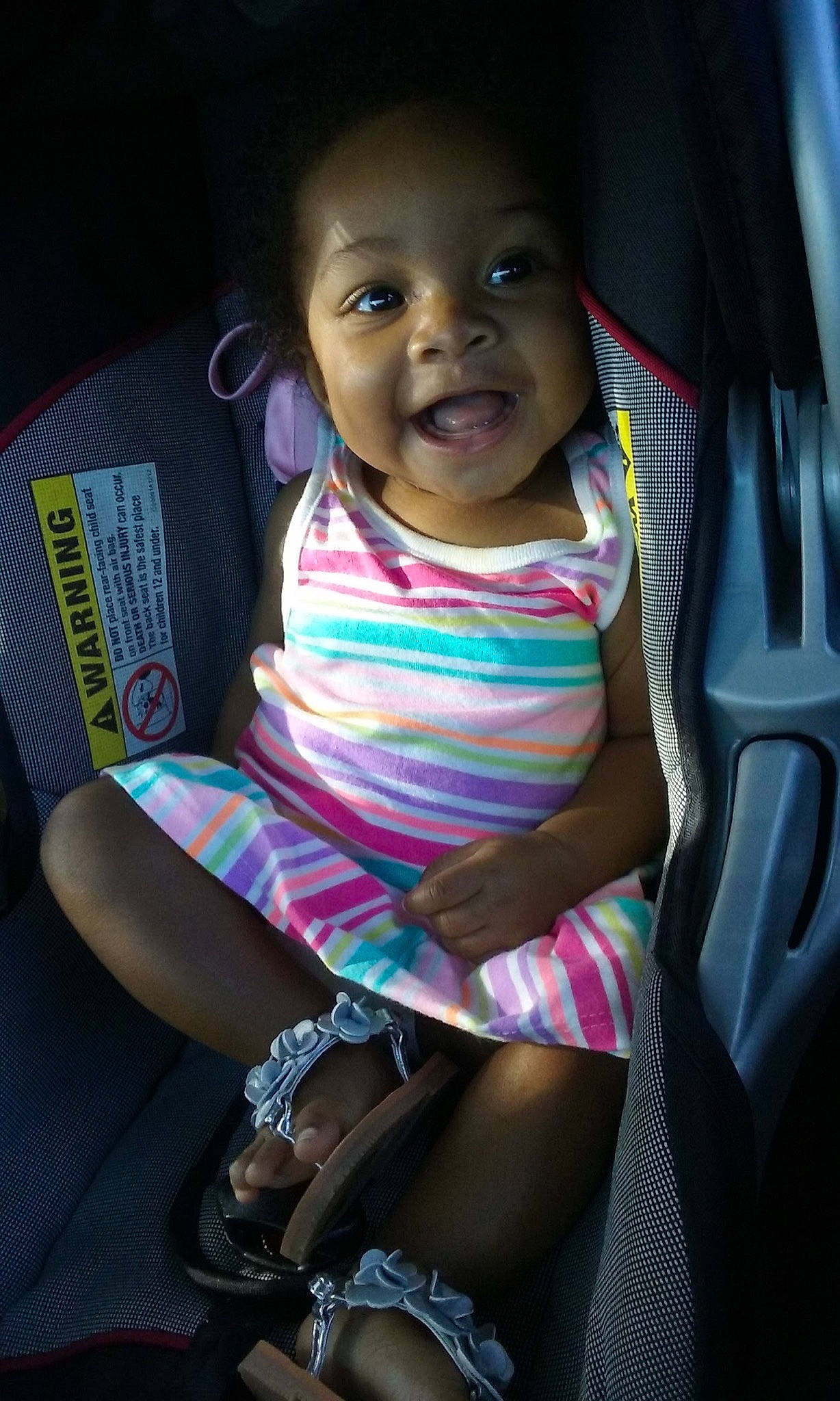 Irielle joined the competition — help win amazing prizes! auto_part, baby, baby_toddler_clothing, car_seat, child, dress, eye, facial_expression, finger, happy, human_body, leg, lip, mammal, mouth, person, sandal, smile, thigh, toddler