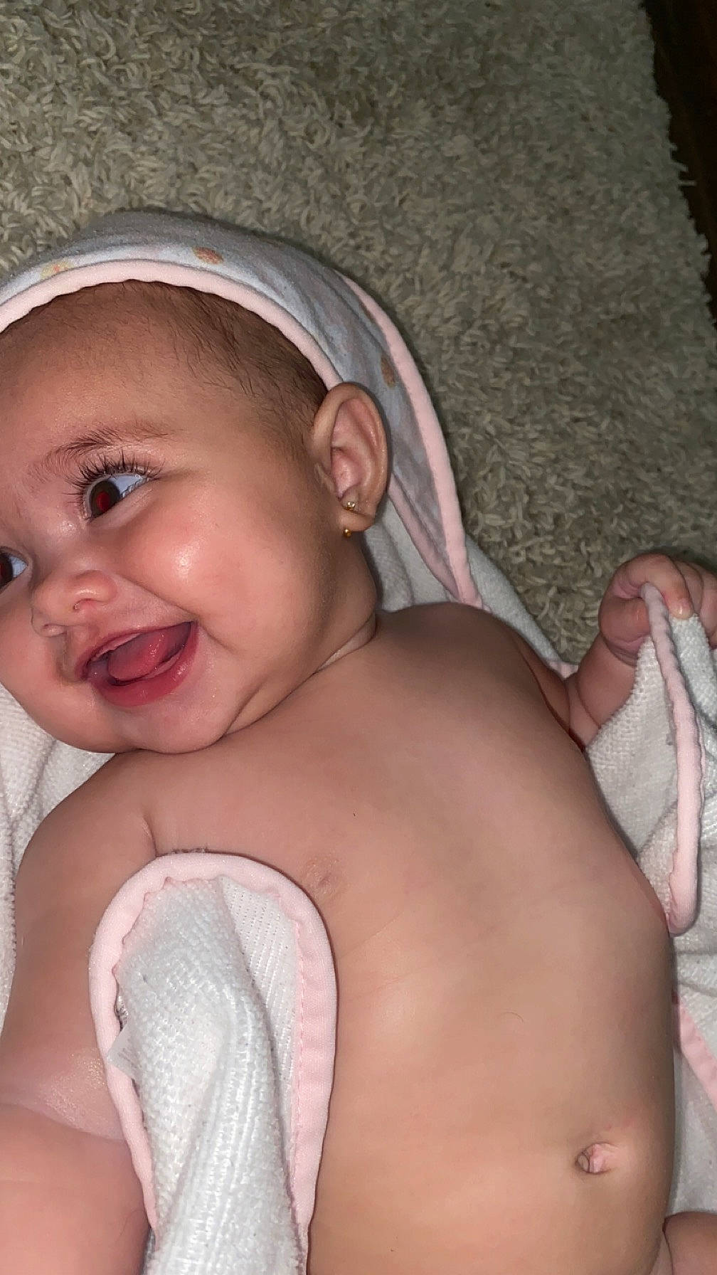 Emma is registered to the contest to win money with this photo: baby, cheek, comfort, ear, eye, eyebrow, eyelash, face, finger, happy, headgear, iris, lip, mouth, neck, nose, person, skin, smile, toddler