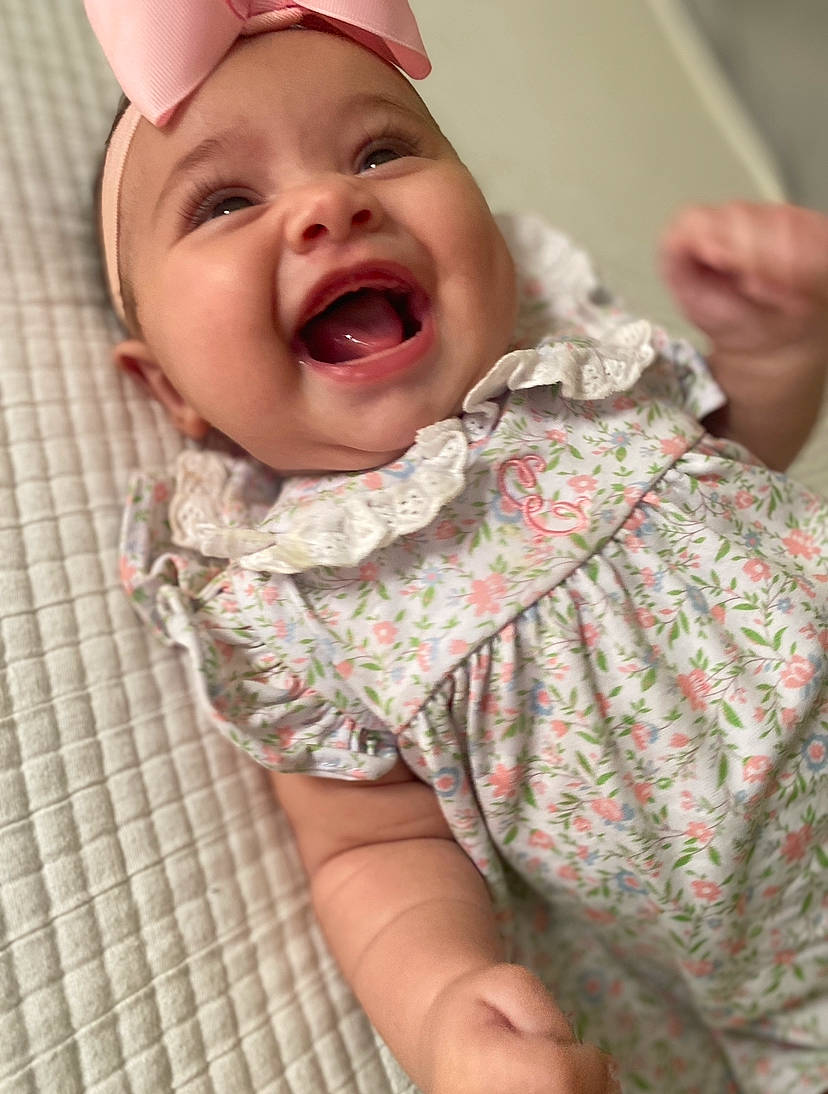 Emma joined the competition — help win amazing prizes! baby, baby_laughing, baby_toddler_clothing, cheek, chin, comfort, eye, eyebrow, face, finger, gesture, happy, headwear, iris, lip, mouth, nose, person, skin, sleeve