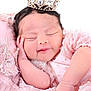 Amira is registered to the contest to win money with this photo: newborn, baby, sleeping, crown, pink_dress, cute, infant, portrait, soft, peaceful, hand, face, delicate, sparkle, jewelry, resting, closeup, adorable, child, soft_lighting