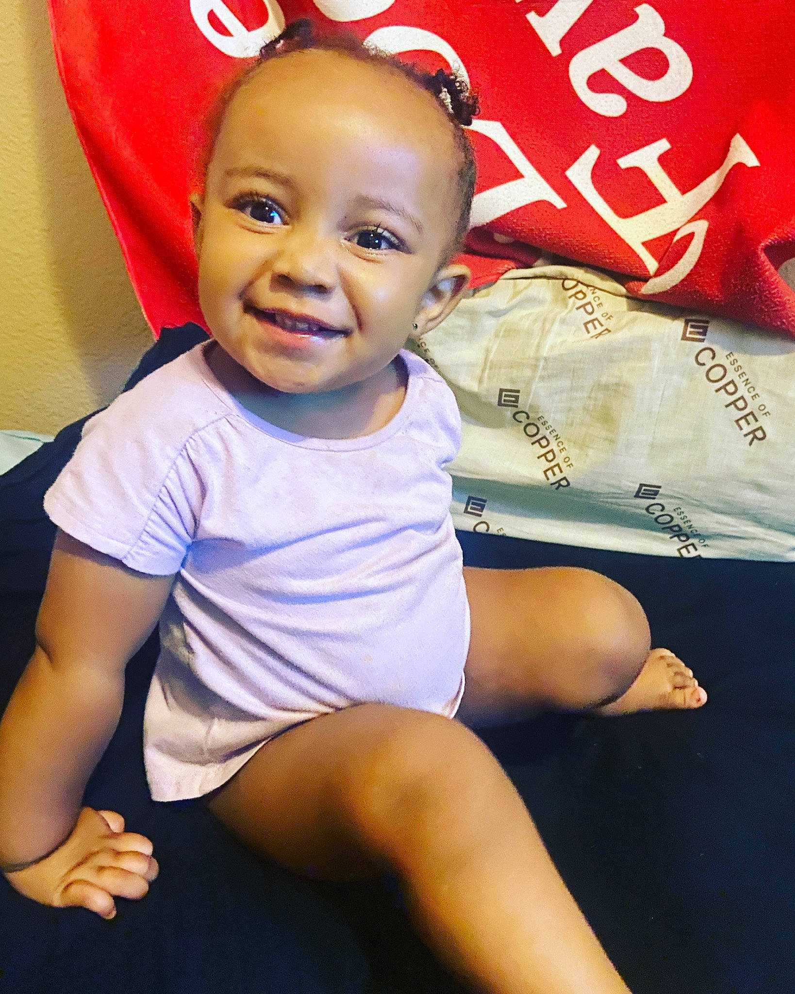 Jayceona Louise is registered to the contest to win money with this photo: abdomen, baby, baby_toddler_clothing, beauty, child, electric_blue, eye, fun, happy, human_leg, joy, logo, magenta, person, portrait_photography, sitting, sleeve, smile, sportswear, t_shirt