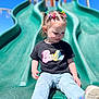 Brooklynn is registered to the contest to win money with this photo: toddler, child, slide, playground, outdoor, jeans, tshirt, barbie, hair_clips, pigtails, shoes, smile, sunny, blue_sky, play, fun, park, young_child, casual_clothing, daytime