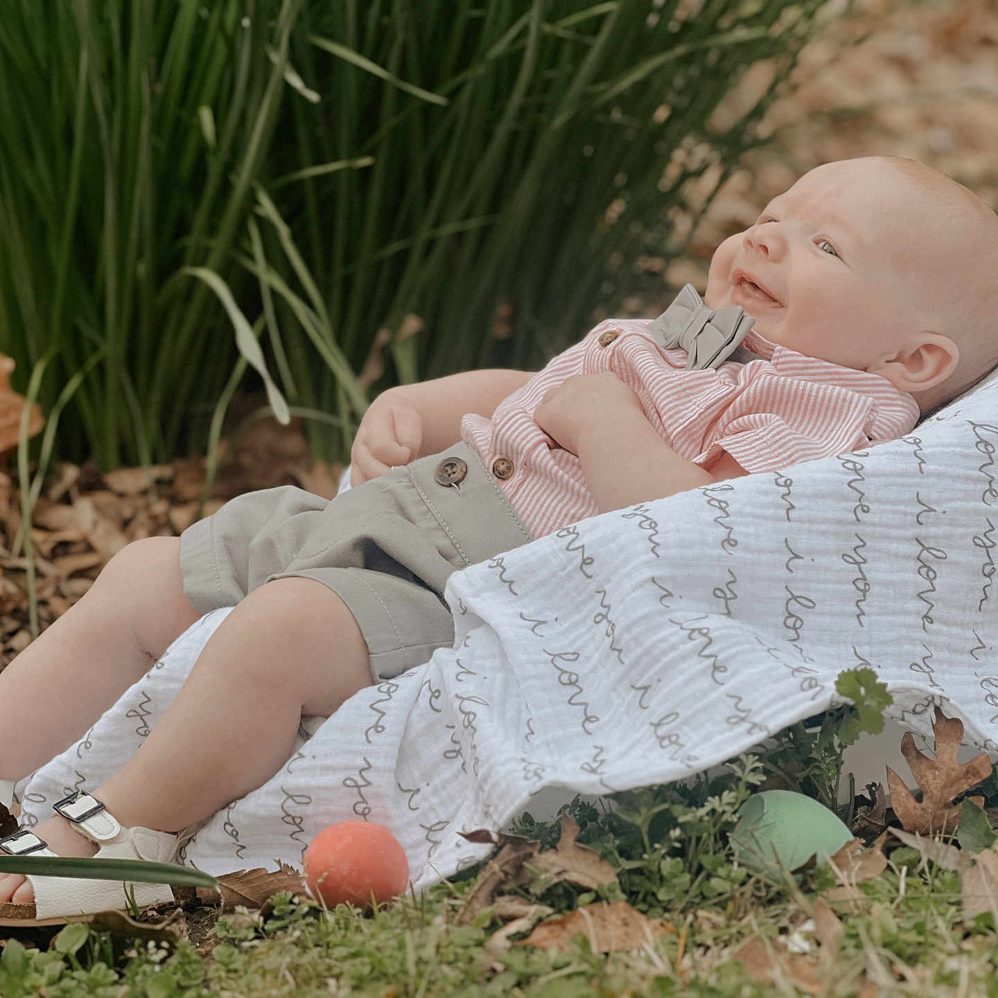 Stetson is registered to the contest to win money with this photo: baby, blanket, bodypart, clothing, face, finger, food, footwear, furniture, grass, hand, happy, head, newborn, person, photography, plant, portrait, sandal, shoe