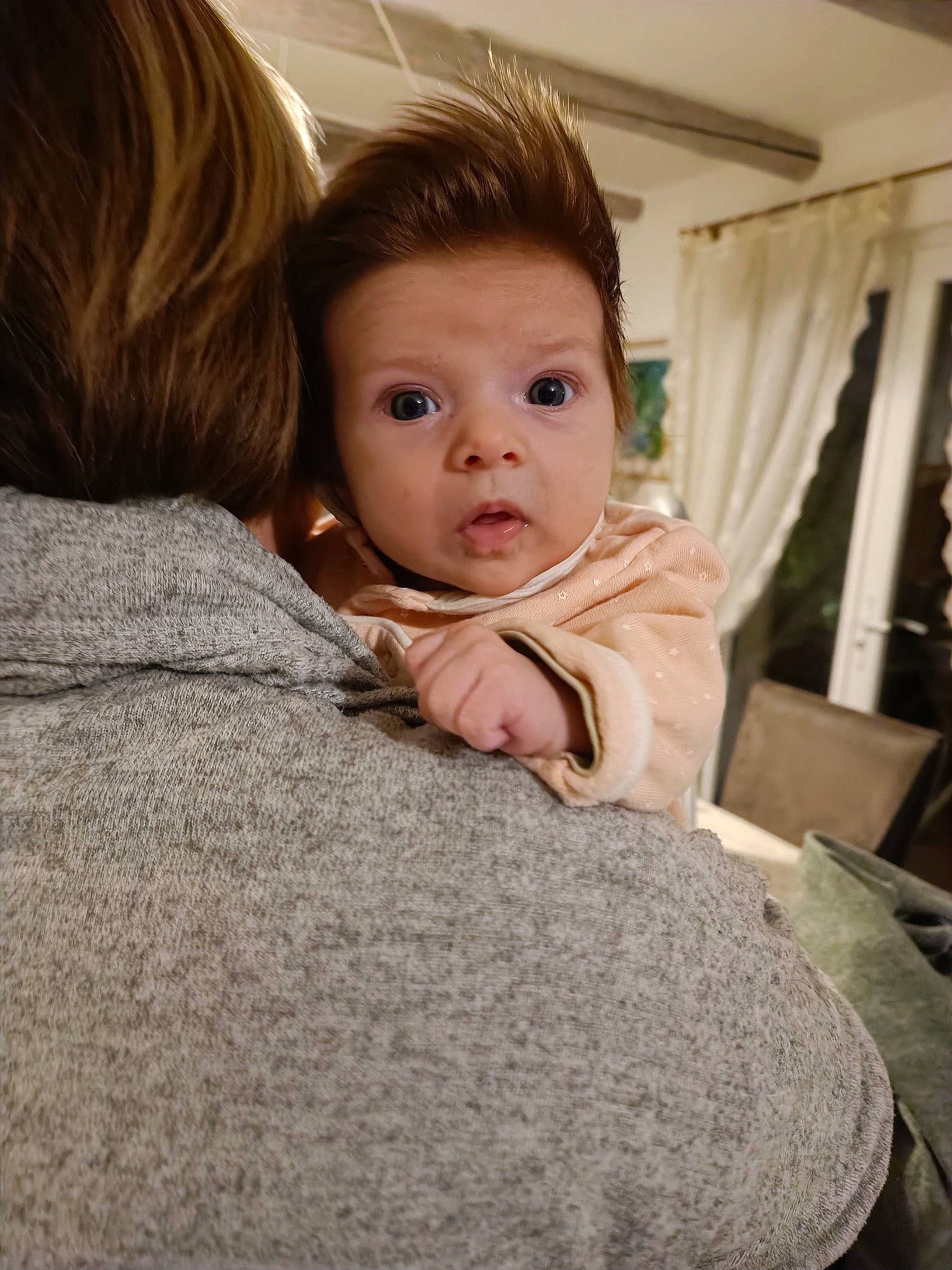 Mia participe au concours pour gagner de l'argent avec cette photo : baby, cheek, child, chin, comfort, curtain, floor, flooring, fur, gesture, happy, linens, nose, person, room, shoulder, sitting, skin, surprise, toddler