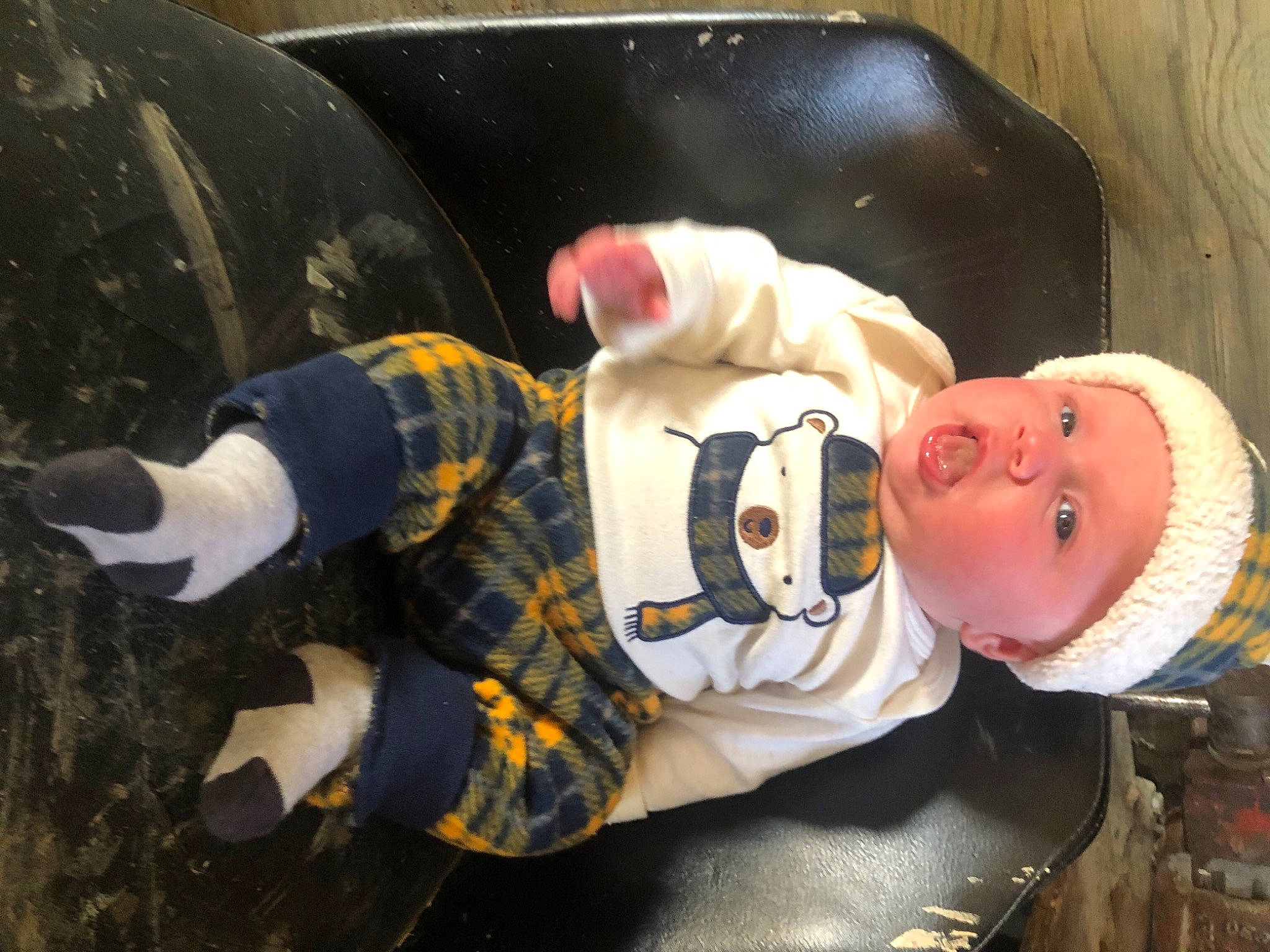 Brayden is registered to the contest to win money with this photo: baby, baby_products, baby_toddler_clothing, child, comfort_food, cooking, fun, fur, hat, headwear, person, personal_protective_equipment, sitting, sleeve, smile, toddler, vehicle_door