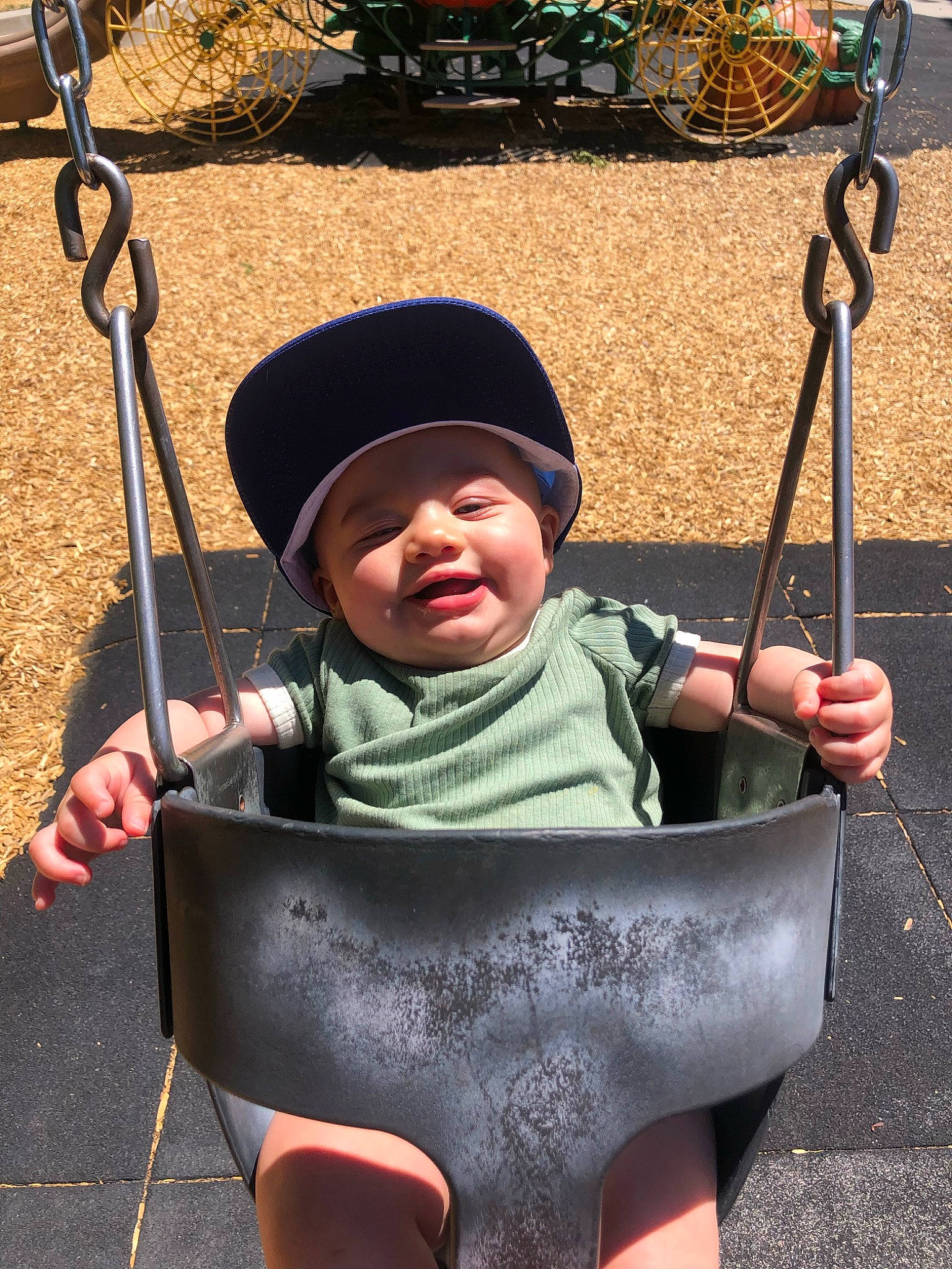 Caspian is registered to the contest to win money with this photo: baby, baby_carriage, baby_toddler_clothing, beauty, blue, child, city, facial_expression, fun, grass, hand, hat, headwear, leaf, leisure, person, photograph, product, sitting, snapshot