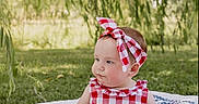 Blair joined the competition — help win amazing prizes! baby, child, infant, sitting, outdoor, portrait, smiling, gingham, dress, headband, bow, quilt, blanket, grass, trees, willow, park, daylight, patriotic, photography