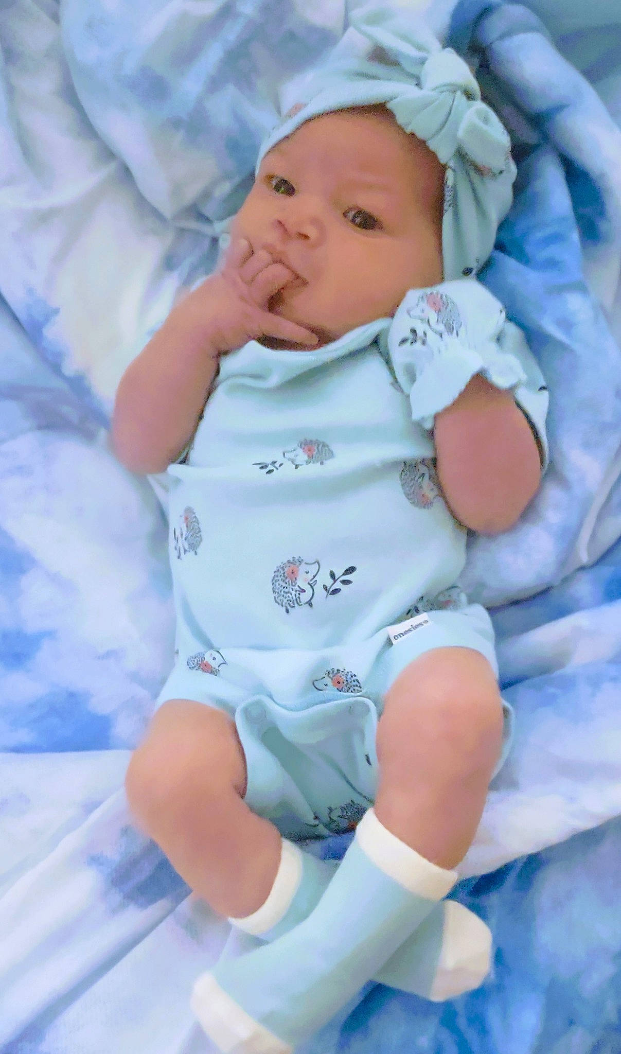 Juliette joined the competition — help win amazing prizes! azure, baby, baby_products, baby_toddler_clothing, cheek, child, comfort, electric_blue, eye, face, happy, headwear, human_leg, linens, pattern, person, pink, sitting, skin, sleeve