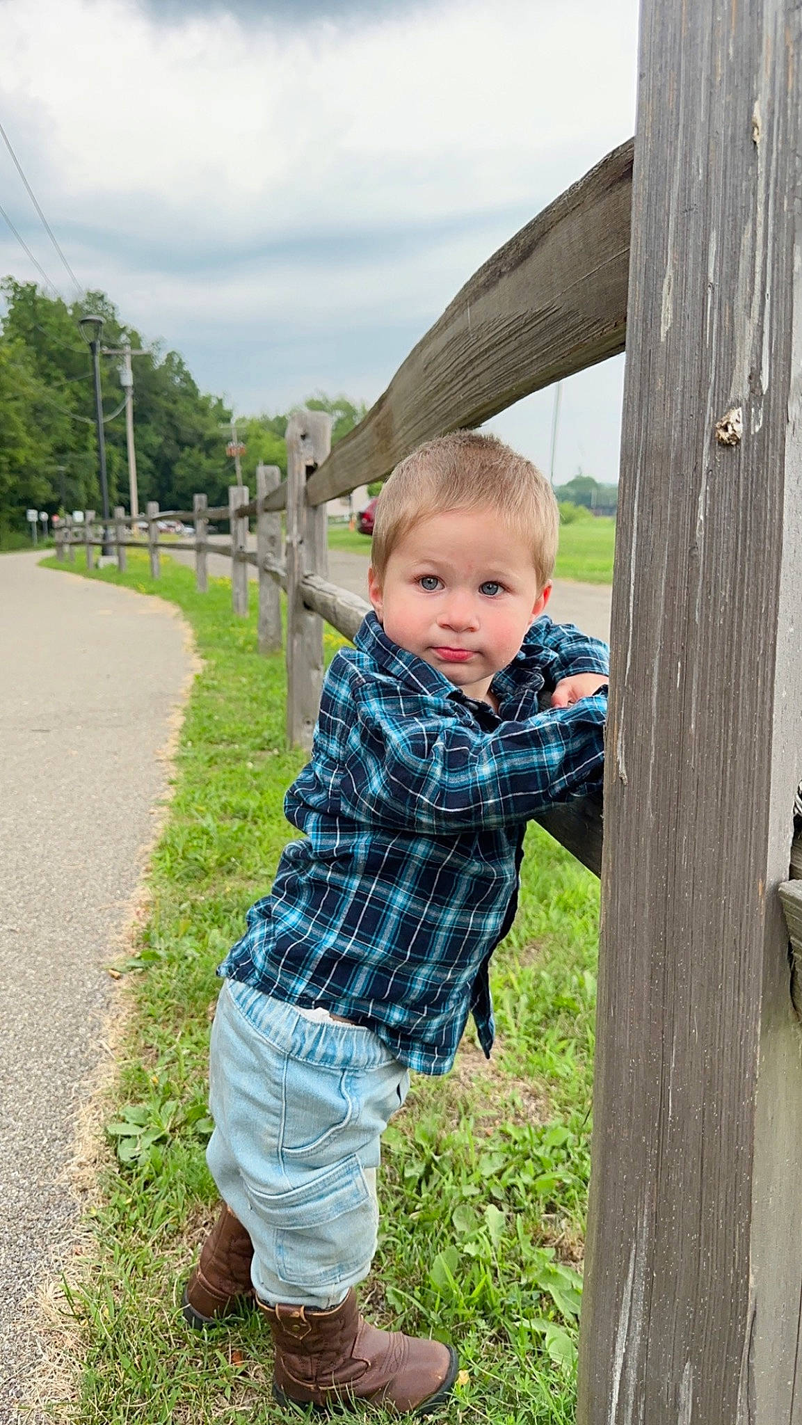 Hunter is registered to the contest to win money with this photo: baby_toddler_clothing, child, cloud, fun, grass, happy, leisure, pattern, people_in_nature, person, plaid, plant, play, recreation, shorts, sitting, sky, t_shirt, toddler, tree