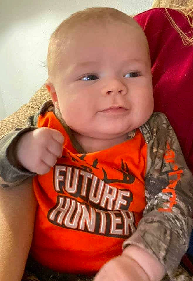 Vander is registered to the contest to win money with this photo: baby, cheek, child, face, lip, nose, orange, person, skin, smile, toddler