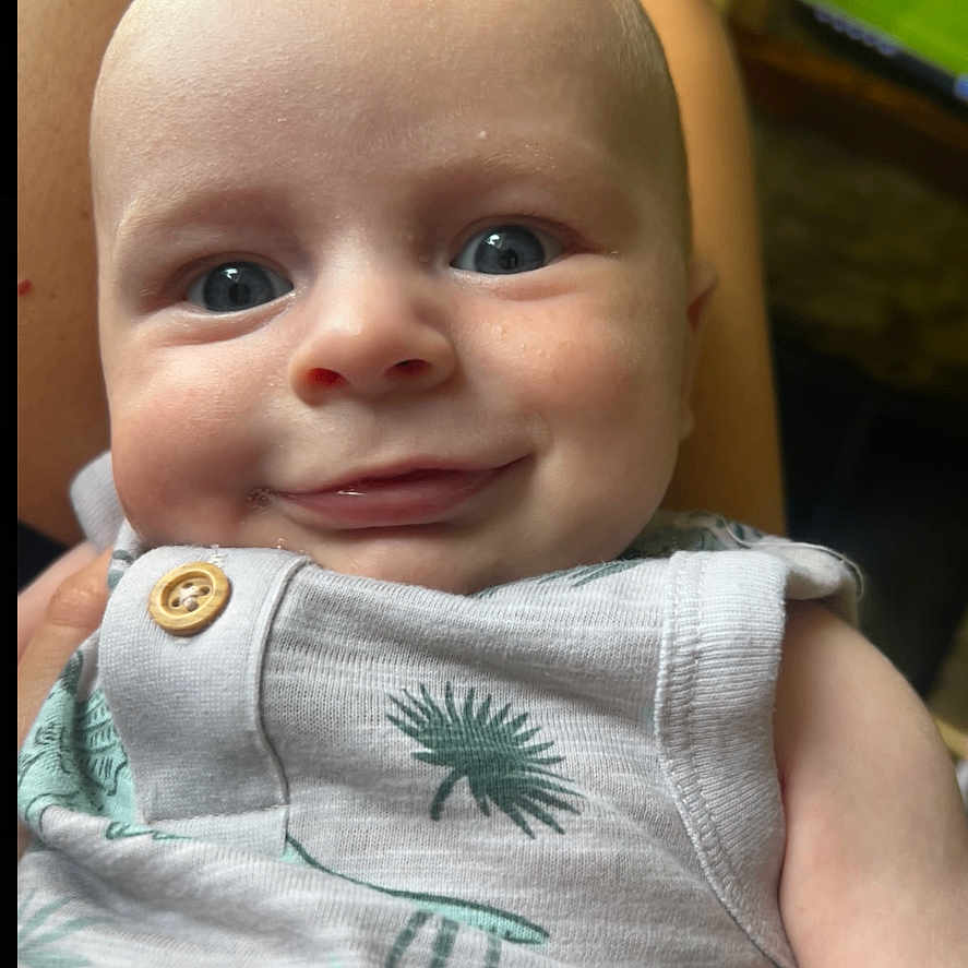 Lenny is registered to the contest to win money with this photo: baby, bodypart, computerhardware, electronics, face, finger, hand, happy, hardware, head, laughing, monitor, mouth, newborn, pattern, person, photography, portrait, screen, smile