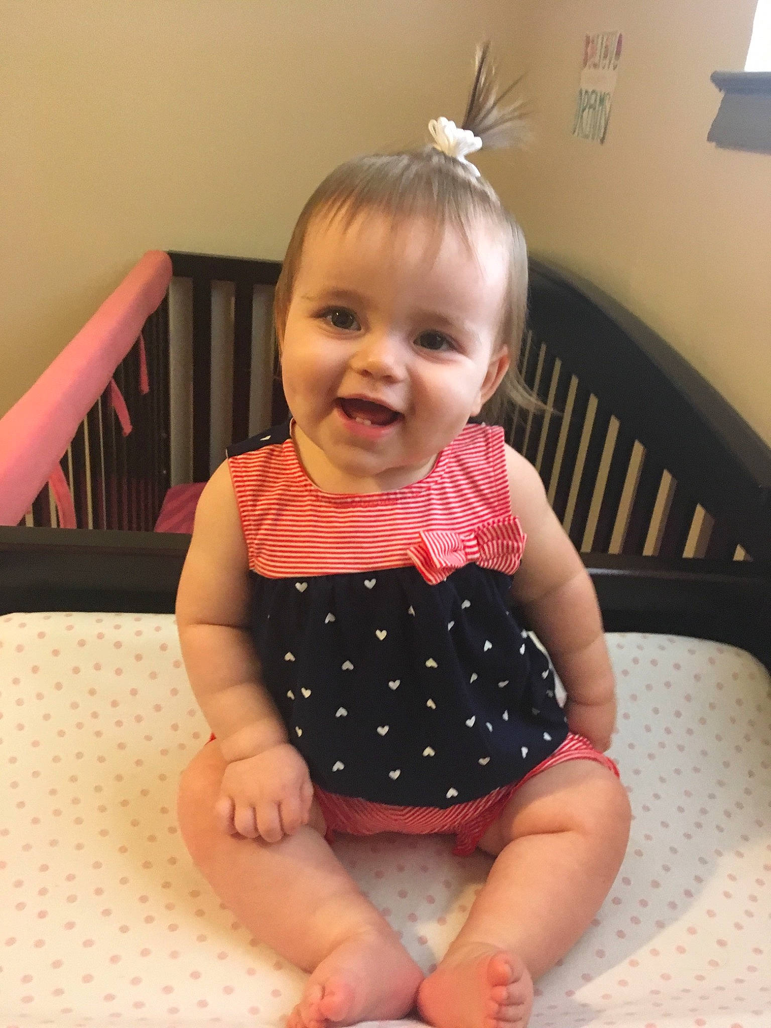 Jayda is registered to the contest to win money with this photo: baby, baby_products, baby_toddler_clothing, cheek, child, design, dress, face, finger, head, iris, joy, pattern, person, pink, polka_dot, product, room, sitting, skin