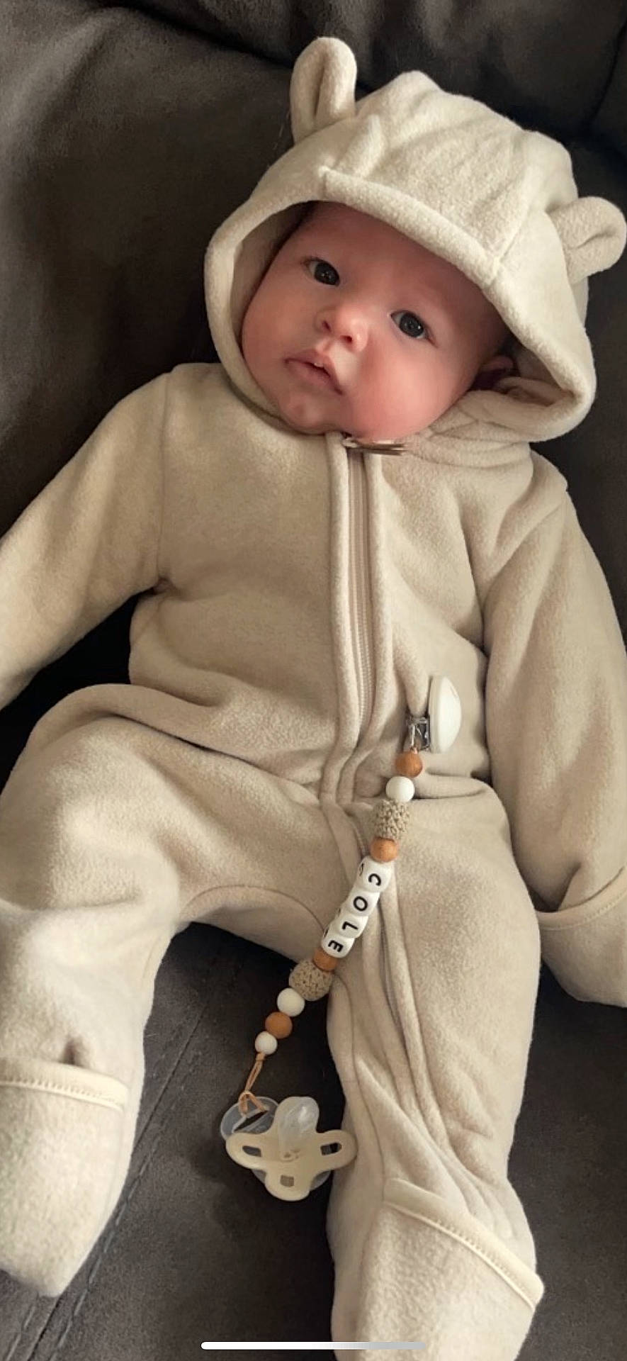 Cole is registered to the contest to win money with this photo: accessories, baby, bonnet, cap, clothing, coat, face, hat, head, hood, hoodie, jacket, jewelry, knitwear, necklace, person, photography, portrait, sweater, sweatshirt