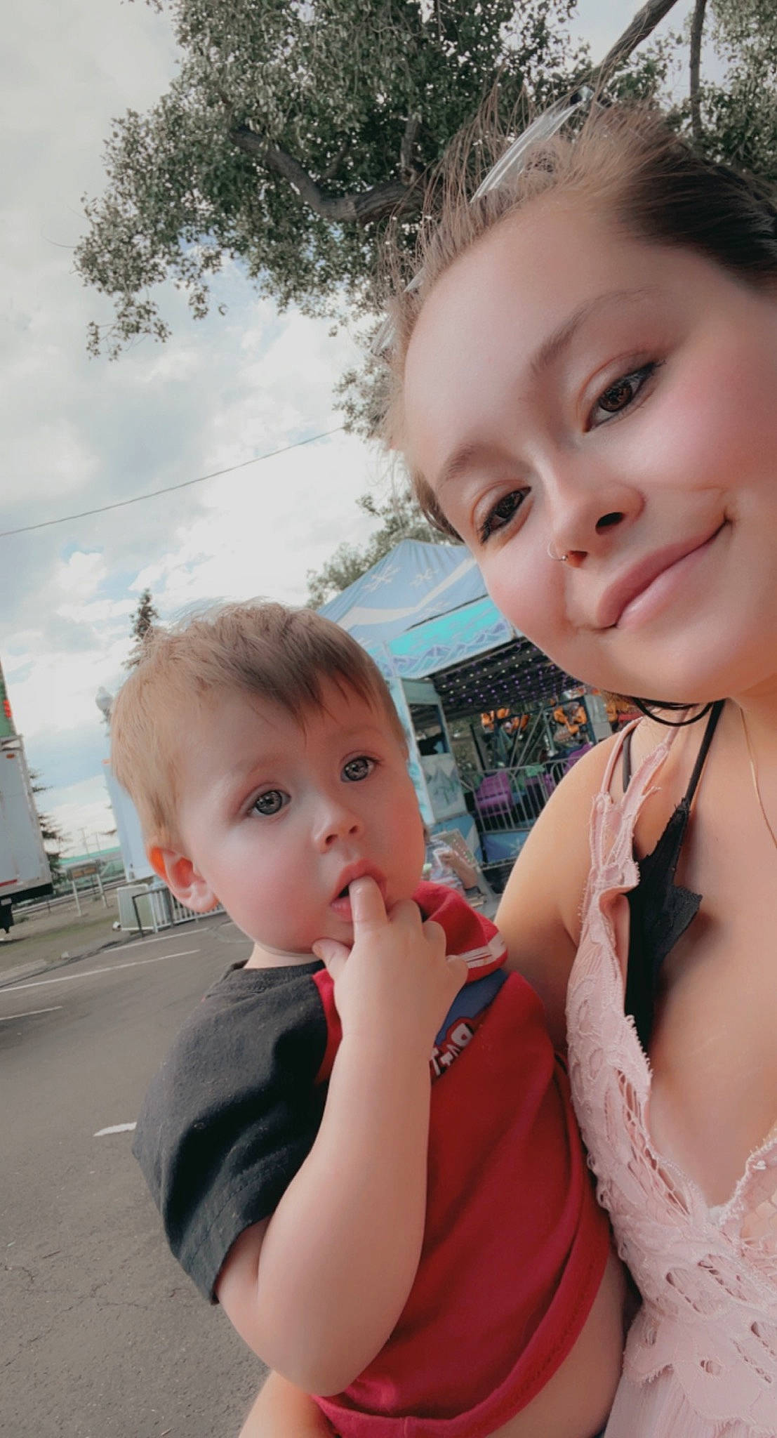 Devan is registered to the contest to win money with this photo: cheek, chin, cloud, eye, eyelash, face, gesture, hair, happy, head, iris, joy, lip, nose, person, skin, sky, smile, standing, summer