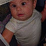 Natalie is registered to the contest to win money with this photo: baby, candid, child, closeup, curious, expression, eyes, face, head, indoor, infant, mesh, netting, person, portrait, screen, skin, texture, white_clothing, young