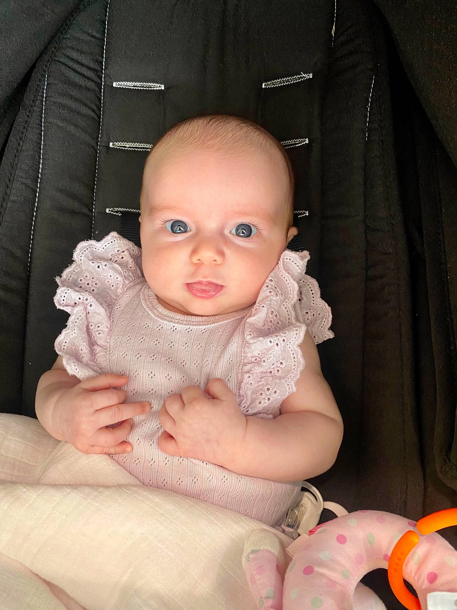 Emilia is registered to the contest to win money with this photo: baby, baby_products, baby_toddler_clothing, car_seat, cheek, child, comfort, fashion_accessory, flash_photography, fur, head, iris, linens, nail, peach, person, sitting, skin, sleeve, thumb