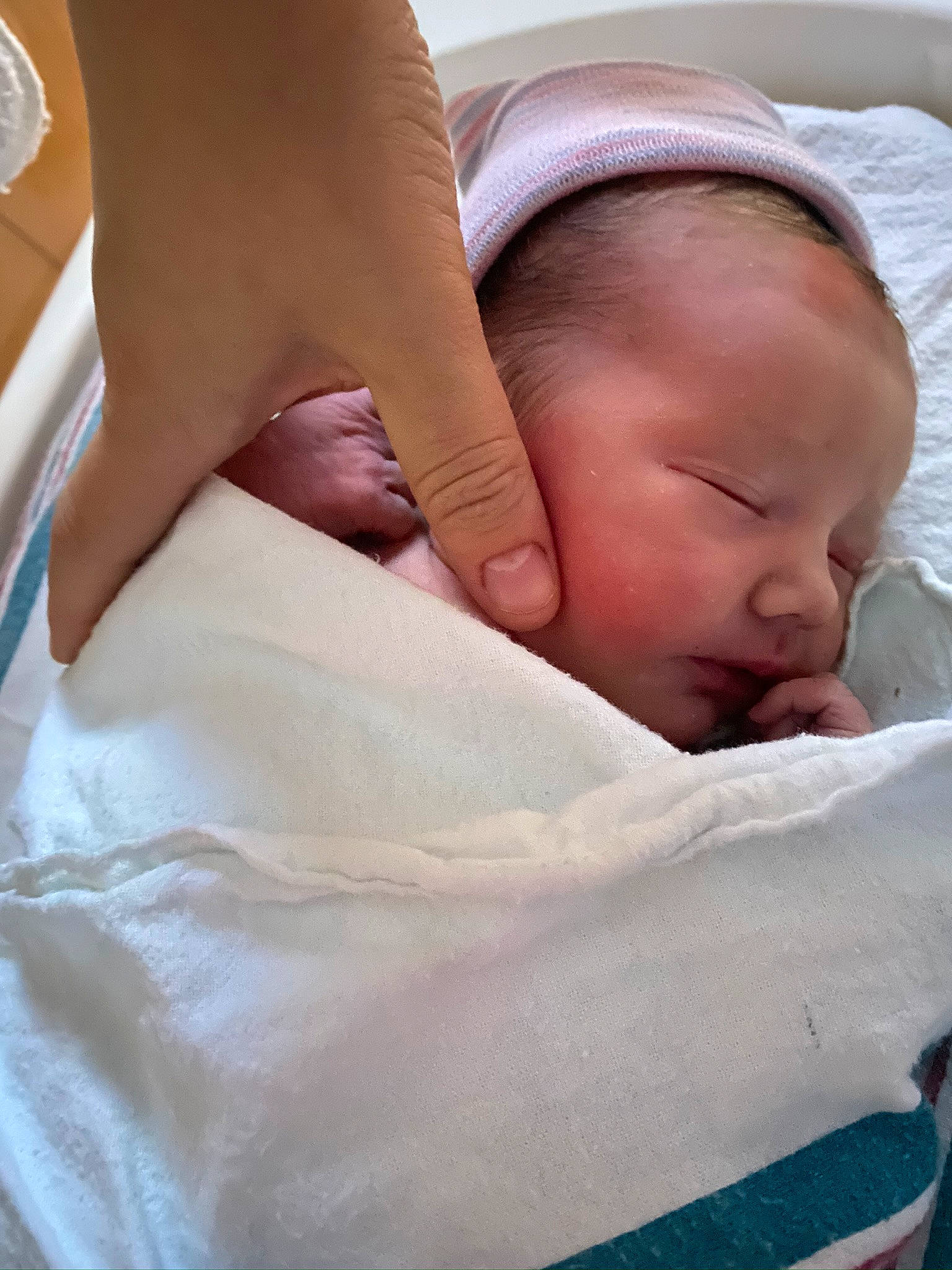 Adrienne is registered to the contest to win money with this photo: abdomen, baby, baby_sleeping, baby_toddler_clothing, bedding, bedtime, child, childbirth, comfort, elbow, gesture, human_leg, knee, linens, mammal, person, room, skin, thigh, thumb