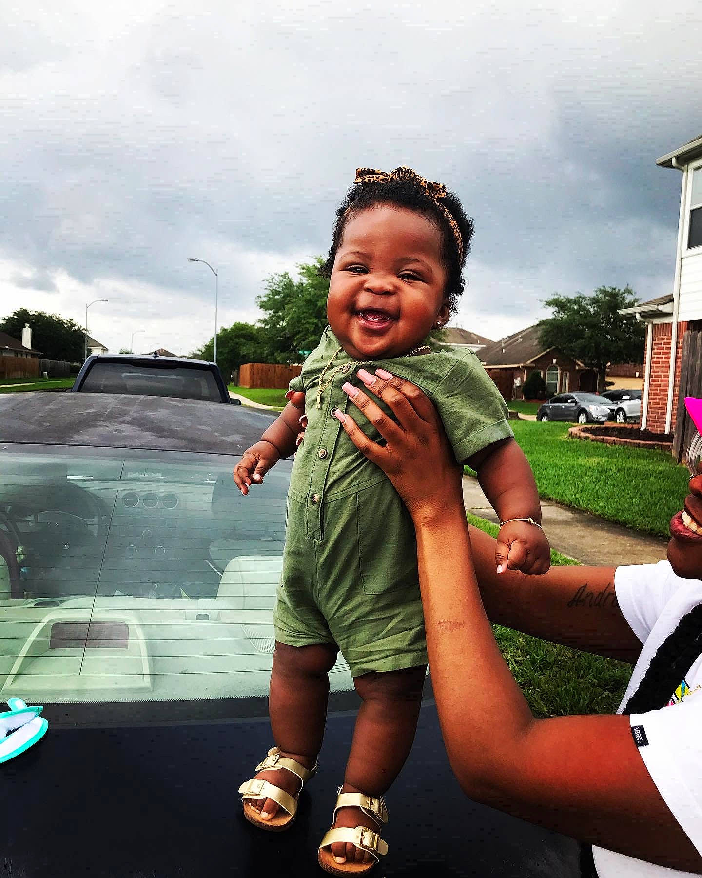 Reign joined the competition — help win amazing prizes! automotive_exterior, child, cloud, event, eyewear, flash_photography, fun, gesture, grass, hand, happy, jewellery, leisure, luxury_vehicle, person, recreation, sky, smile, toddler, travel