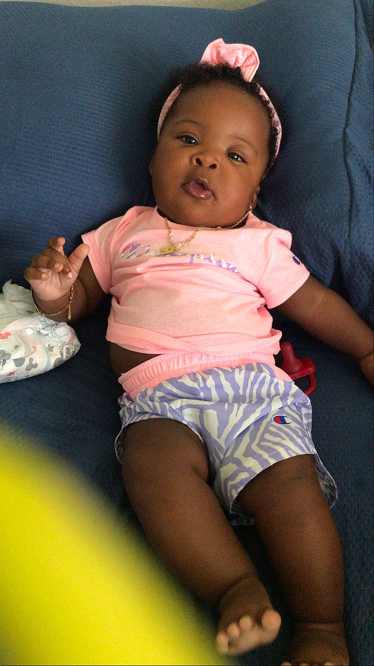 Reign joined the competition — help win amazing prizes! baby, baby_toddler_clothing, cheek, comfort, eye, face, finger, flash_photography, happy, head, knee, leg, lip, mouth, person, pink, shorts, skin, sleeve, stomach