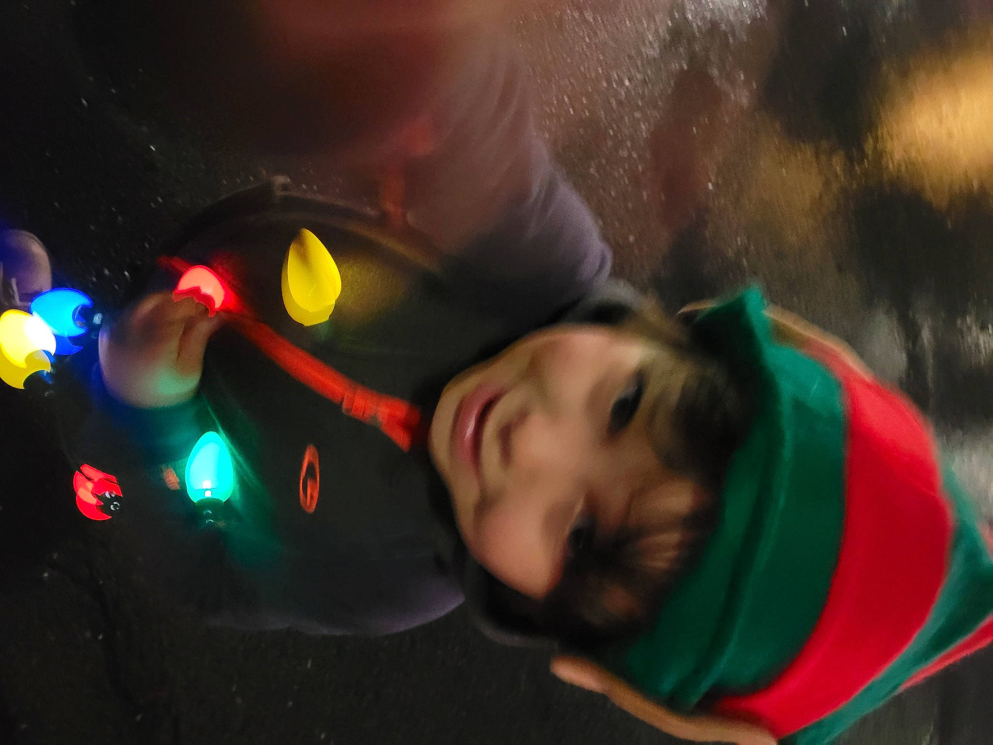 Finley is registered to the contest to win money with this photo: audio_equipment, automotive_lighting, child, darkness, entertainment, event, eyewear, flash_photography, fun, grass, happy, headwear, joy, leisure, lens_flare, night, orange, person, plant, recreation