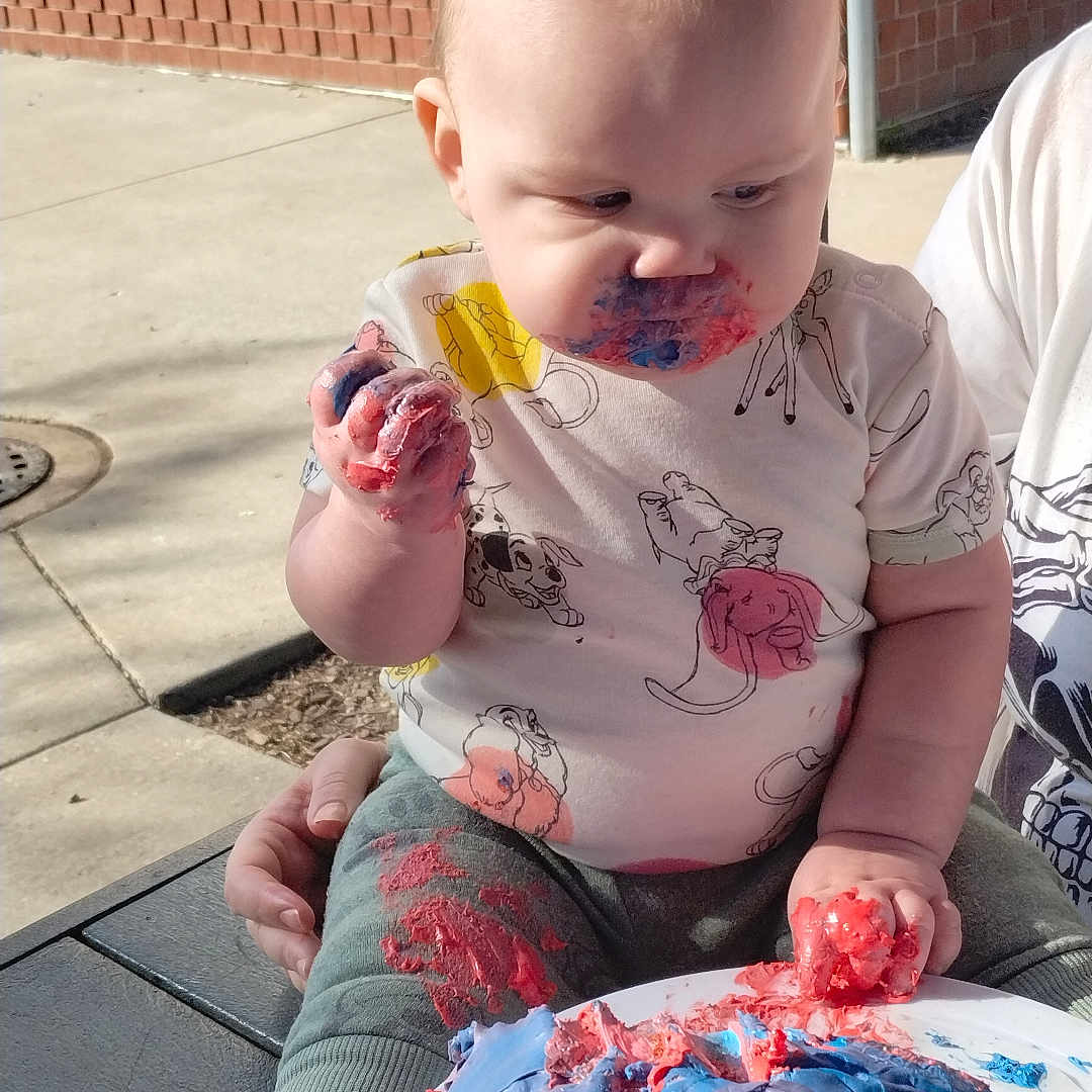 Jaxson is registered to the contest to win money with this photo: baby, birthdaycake, bodypart, cake, clothing, cream, dessert, face, finger, food, hand, head, hosiery, icecream, icing, person, photography, portrait, sock, t_shirt