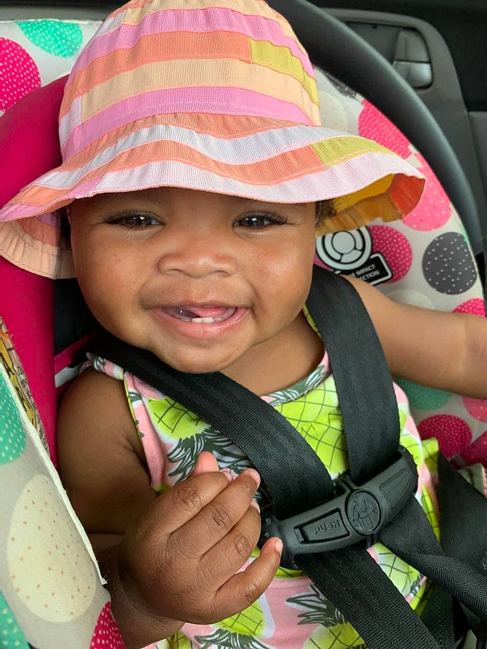 Kaliyah joined the competition — help win amazing prizes! baby, baby_toddler_clothing, beauty, cap, child, eye, face, green, happy, hat, head, headwear, iris, lip, person, photograph, pink, skin, smile, sun_hat