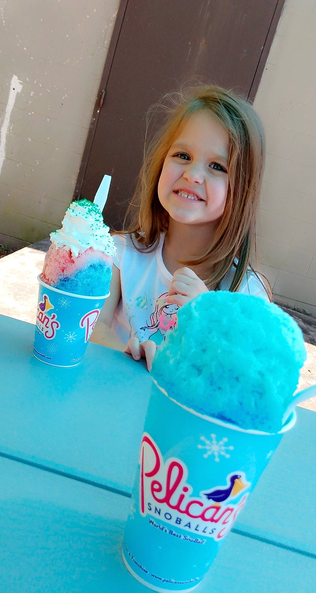 Zoey is registered to the contest to win money with this photo: aqua, azure, birthday, blue, cone, dessert, drink, electric_blue, event, food, frozen_dessert, green, happy, ice_cream, joy, party, party_supply, person, pink, smile