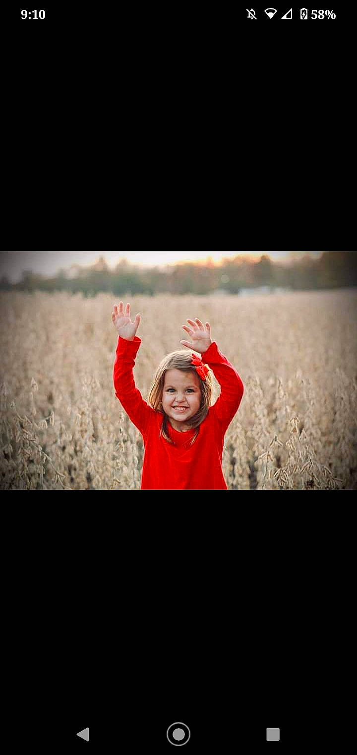 Zoey is registered to the contest to win money with this photo: child, cloud, darkness, face, flash_photography, fun, gesture, grass, grassland, happy, joy, landscape, laugh, magenta, people_in_nature, person, portrait_photography, sitting, sky, smile