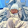 River-Lee is registered to the contest to win money with this photo: newborn, baby, sleeping, hat, onesie, blanket, hospital_bed, blue, infant, soft_fabric, peaceful, cute, child, bed, resting, portrait, indoors, person, cozy, knitted_hat