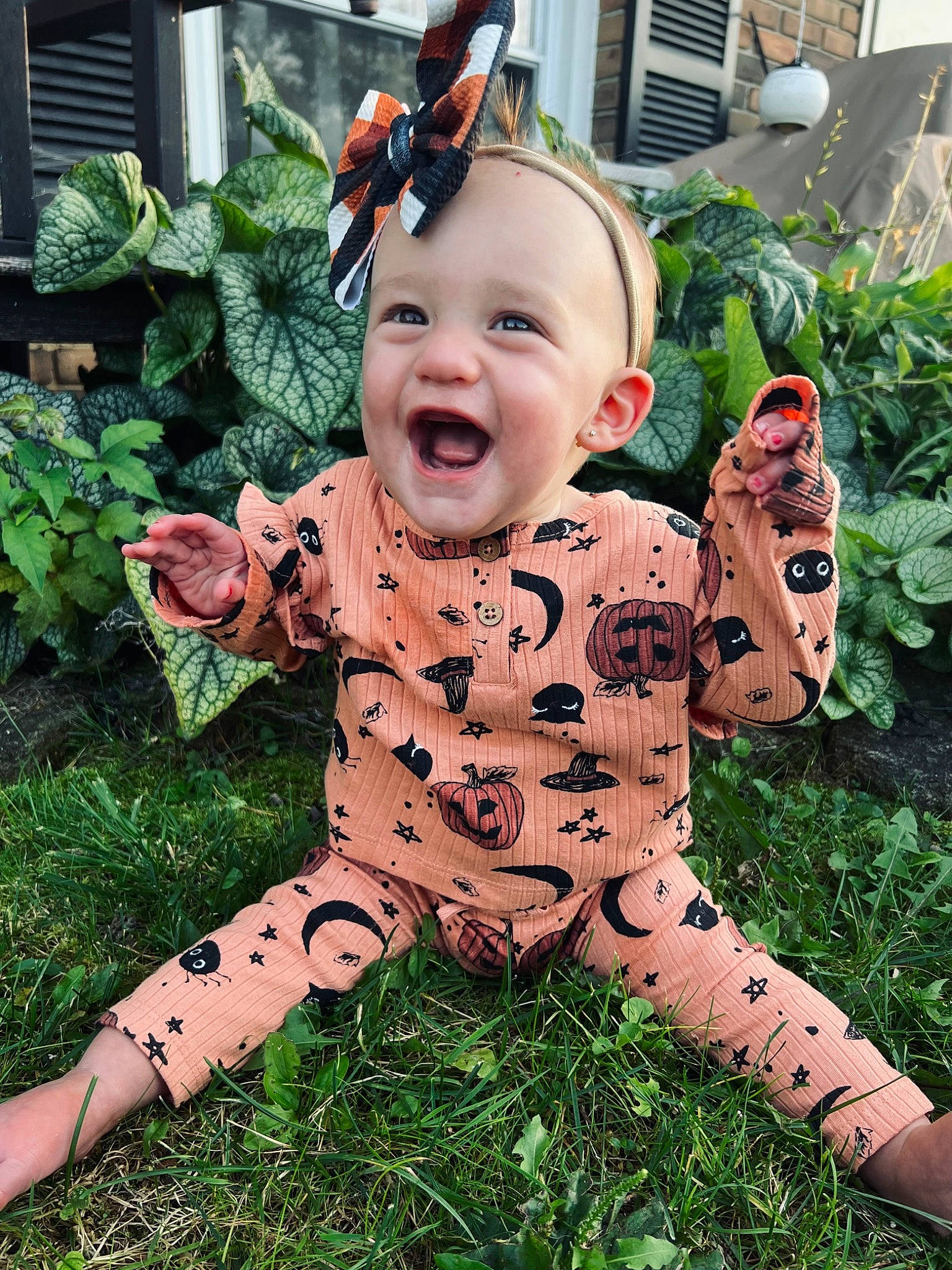 Dixie is registered to the contest to win money with this photo: baby, baby_toddler_clothing, child, fawn, fictional_character, garden, grass, happy, holiday, lawn, lawn_ornament, pattern, people_in_nature, person, plant, sitting, sleeve, smile, toddler, toy
