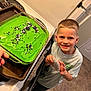Benjamin is registered to the contest to win money with this photo: appliance, baking, boy, child, cooking, cream, dessert, device, electricaldevice, face, food, foodpresentation, head, icing, male, oven, person, photography, portrait, sweets