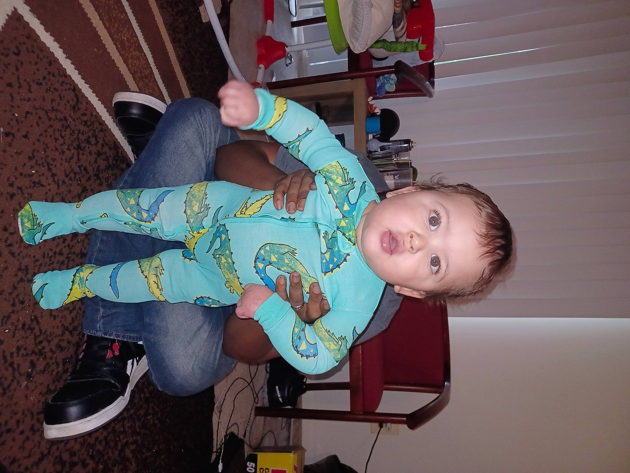 Dante is registered to the contest to win money with this photo: baby, baby_products, baby_toddler_clothing, child, cross_training_shoe, fun, human_leg, leg, outdoor_shoe, pattern, person, sitting, smile, sock, toddler, walking_shoe