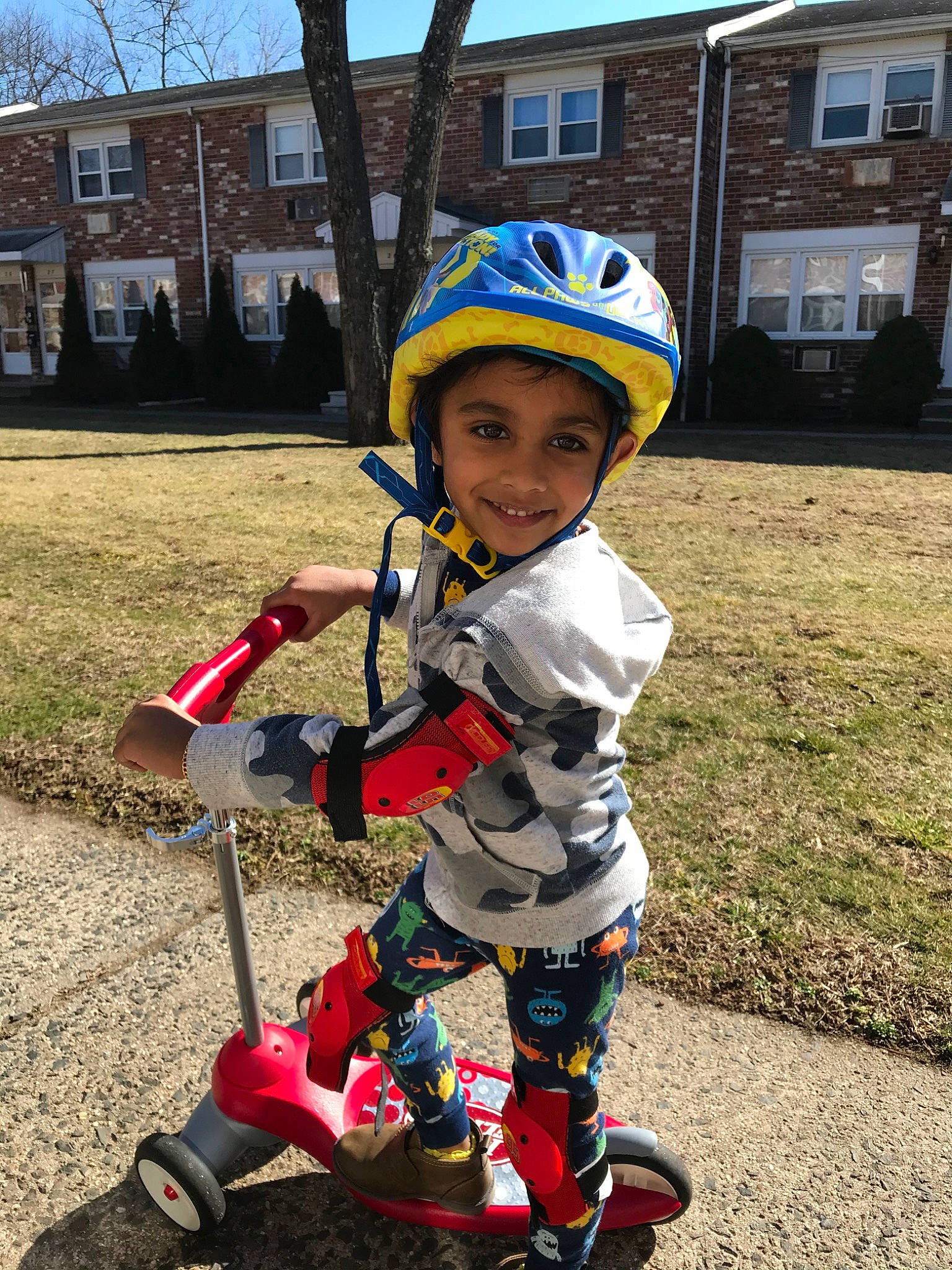 Ayaan is registered to the contest to win money with this photo: child, headwear, helmet, joy, kick_scooter, person, personal_protective_equipment, play, recreation, toddler, vehicle