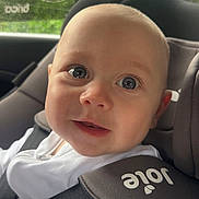 Cruz joined the competition — help win amazing prizes! baby, child, car_seat, seatbelt, white_clothing, smile, face, head, eyes, infant, indoors, window, rain, car, safety, straps, cute, portrait, closeup, young