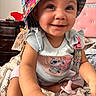 baby, child, smiling, hat, colorful, indoor, bed, bedding, pacifier, shirt, cartoon, cute, happy, person, infant, closeup, face, hand, furniture, room