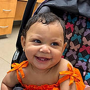 Aahmiyahlovely joined the competition — help win amazing prizes! baby, child, smiling, orange_clothing, stroller, butterfly_pattern, happy, cute, earrings, portrait, indoor, infant, toddler, face, human, seat, bright_colors, cheerful, baby_girl, closeup