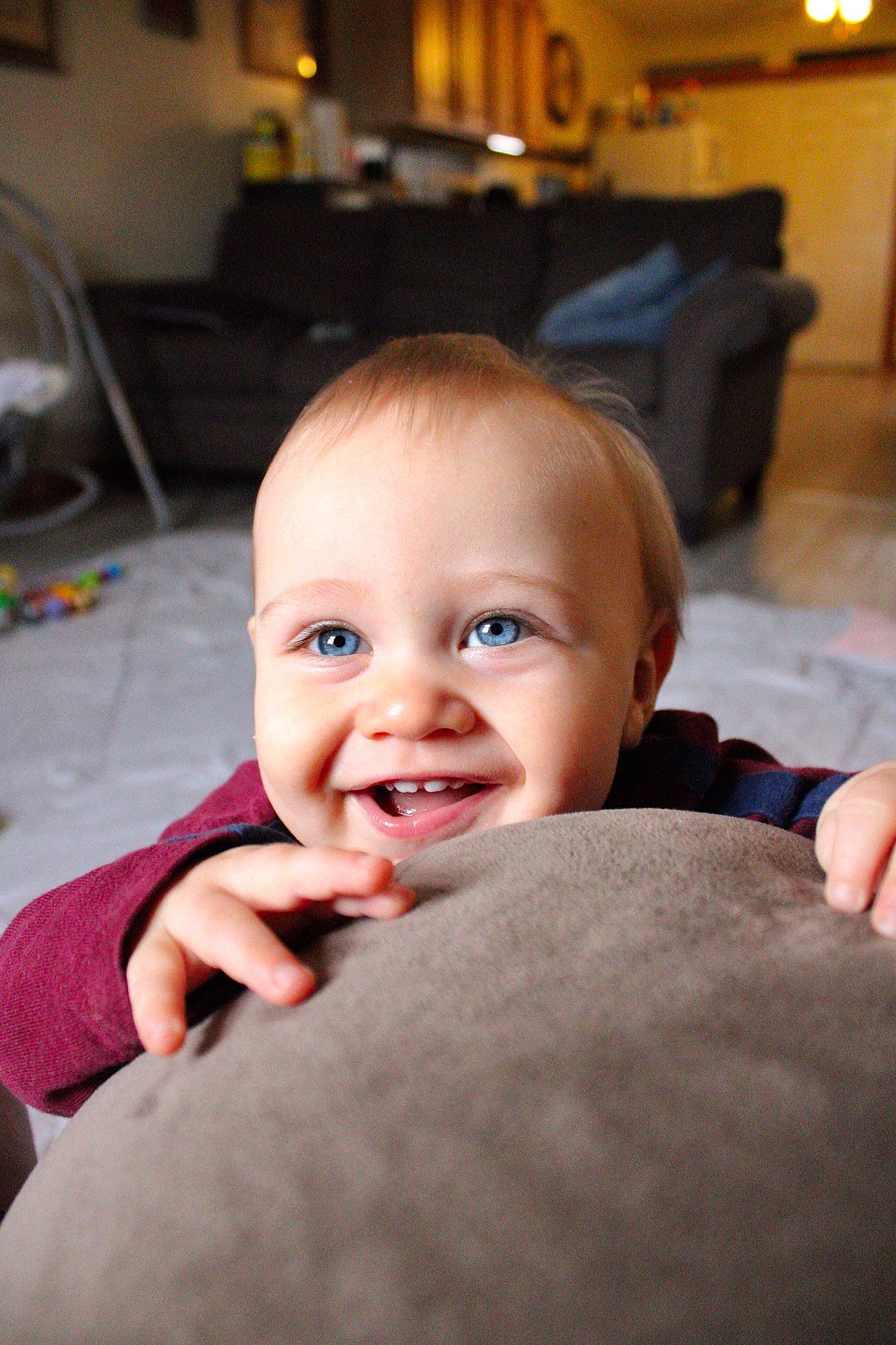 Xzavier is registered to the contest to win money with this photo: baby, cheek, child, comfort, ear, eyebrow, finger, flash_photography, floor, flooring, gesture, happy, iris, joy, lip, living_room, mouth, nose, person, skin